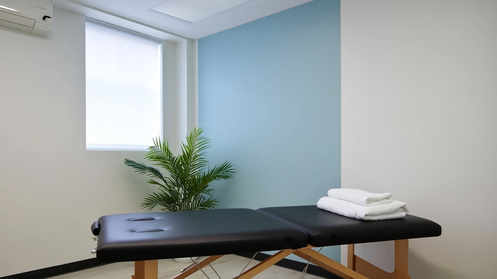 Calm, private physical therapy treatment room with a padded table and natural light, similar to the Enhance PT studio in Stillwater, MN